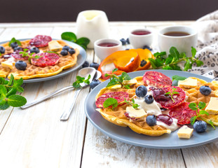 Coffee and Belgium waffles with blueberry. Breakfast concept.