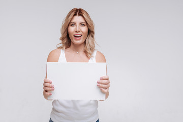Emotional charismatic young woman looking excited