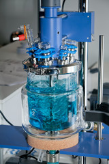 Glass reactor system with blue liquid cloe up view