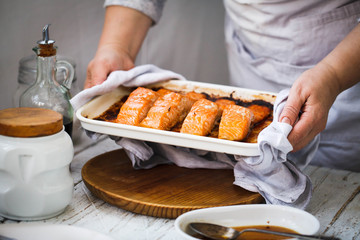 Salmon baked. Salmon fish hot fillets in baking tray. 