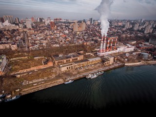 Thermal power plant on the river shore. Aerial view.