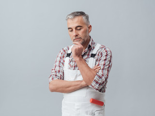 Pensive painter with hand on chin © stokkete