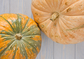 Top view of fresh pumpkins on blue wooden backgrounds.