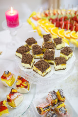 Different delicious desserts and cakes on table