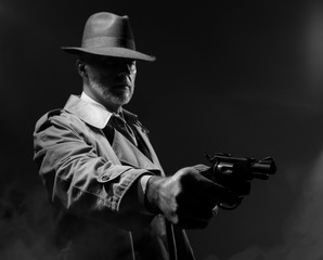 Spy agent pointing a gun