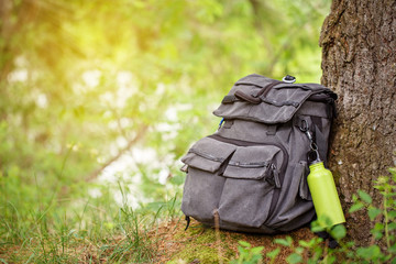 trekking heavy backpack in forest