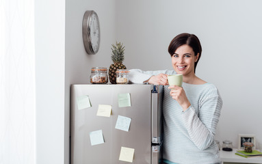 Woman having a coffee break at home