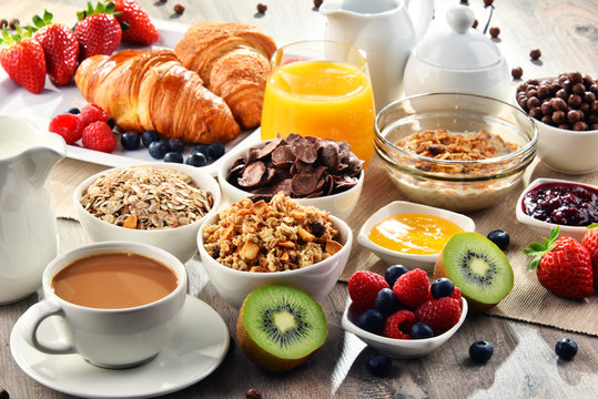 Breakfast served with coffee, juice, croissants and fruits