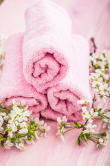 Rolled pink towel with flowers