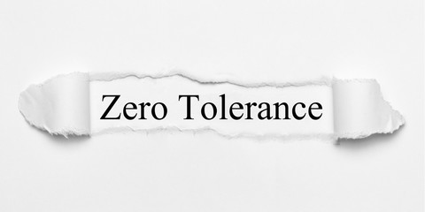 Zero Tolerance on white torn paper