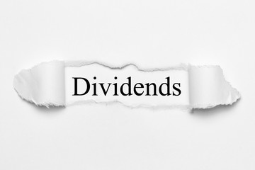 Dividends on white torn paper