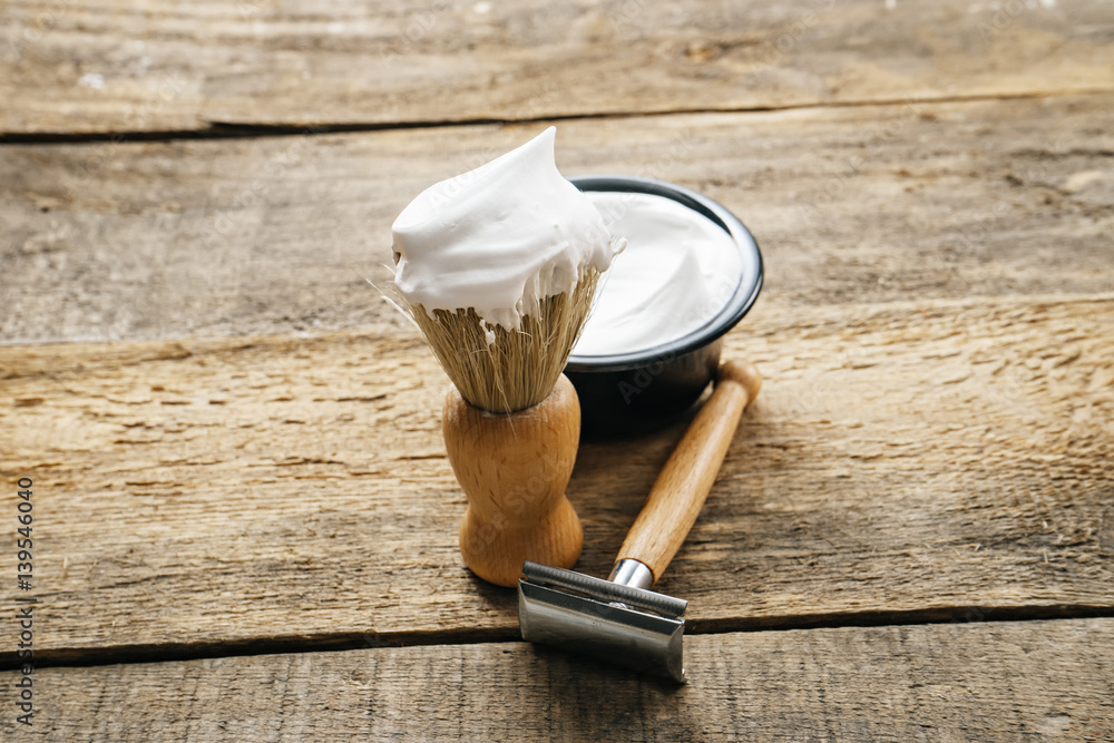 Wall mural mens shaving kit on wooden background