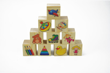Toy wooden pyramid of blocks with pictures