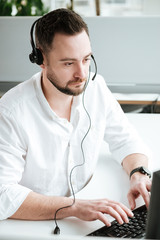 Vertical image of Man using computer