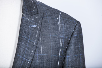 Details of a tailored suit jacket