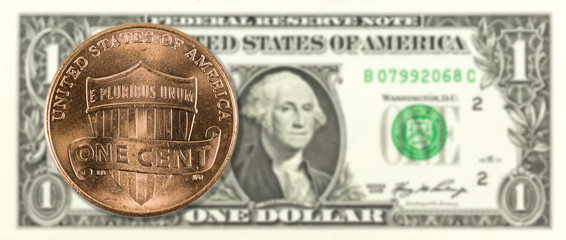 1 cent coin against 1 us-dollar bank note obverse