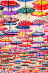 Fototapeta na wymiar Colorful umbrellas on the ceiling of the largest mall in the world Dubai Mall UAE.