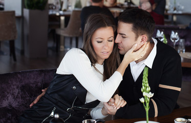 Beautiful couple in restaurant.