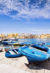Fishermen`s boats in Gallipoli town, Apulia, Southern Italy