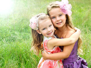  Portrait of two embracing cute little girls