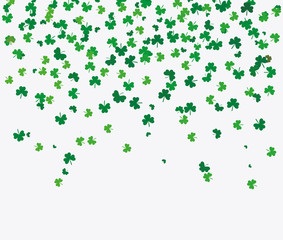 Flying leaves of clover different shades of green on a light background. Pattern for St. Patrick's Day. Rectangular, horizontal wallpaper. Vector illustration with copy space