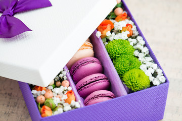 gift box with flowers and macaroon closeup