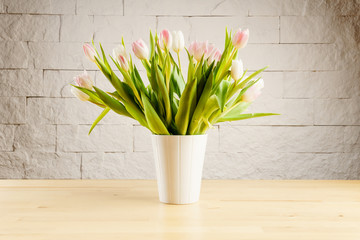 bouquet of white and pink tulips in a vase on the table
