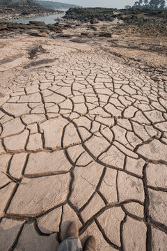 Dry ground surface crack texture, drought effect.