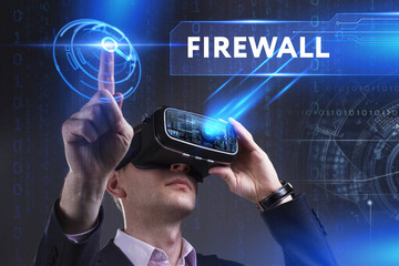 Business, Technology, Internet and network concept. Young businessman working in virtual reality glasses sees the inscription: Firewall