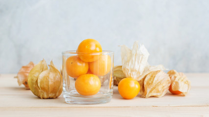 Cape gooseberry on wooden background.