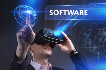 Business, Technology, Internet and network concept. Young businessman working in virtual reality glasses sees the inscription: Software