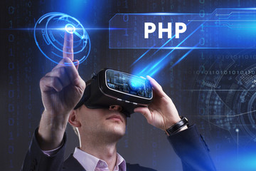 Business, Technology, Internet and network concept. Young businessman working in virtual reality glasses sees the inscription: PHP