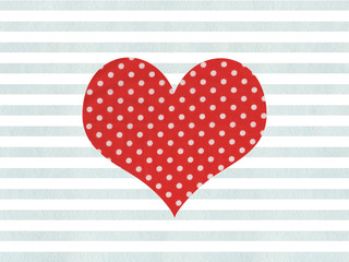 Red fabric polka dot heart on watercolor blue stripes background.