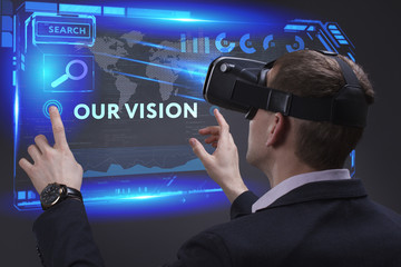 Business, Technology, Internet and network concept. Young businessman working on a virtual screen of the future and sees the inscription: Our vision