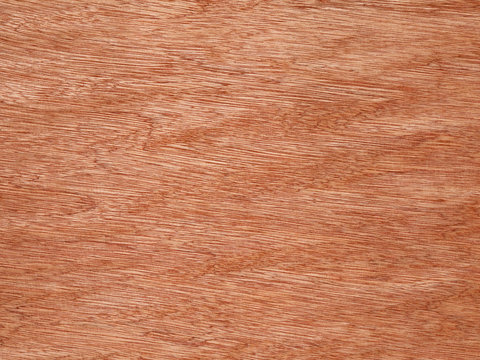Orange color wood grain texture surface detail.
