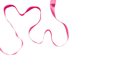 Two hearts made from red ribbon on white background