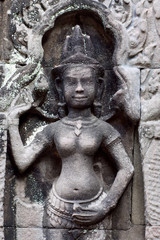 Fototapeta na wymiar Ancient bas-relief with Apsara in Angkor temple, Cambodia