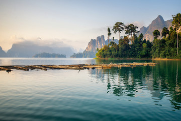 Fototapeta premium Beautiful mountains lake river sky and natural attractions in Ratchaprapha Dam at Khao Sok National Park, Surat Thani Province, Thailand.