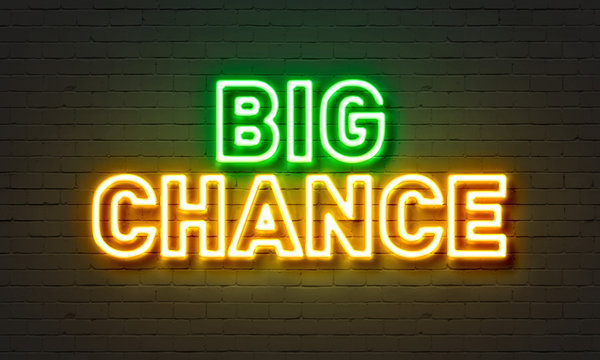 Big chance neon sign on brick wall background.