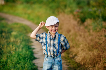 Young boy playing in the fields in rural areas.