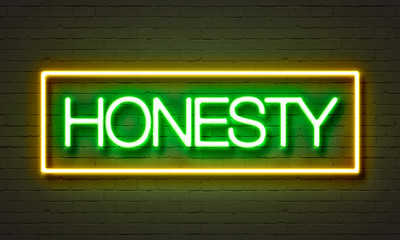 Fototapeta premium Honesty neon sign on brick wall background.
