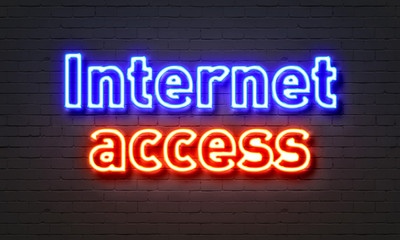 Internet access neon sign on brick wall background.