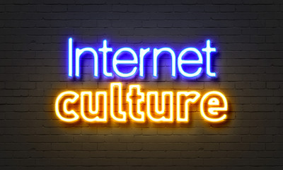 Internet culture neon sign on brick wall background.