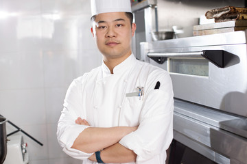 young man chelf in modern kitchen