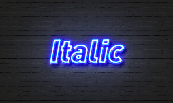 Italic neon sign on brick wall background.