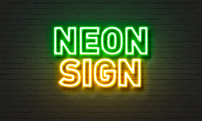 Neon sign on brick wall background.