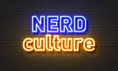 Nerd culture neon sign on brick wall background.