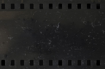 Strip of old celluloid film with dust and scratches