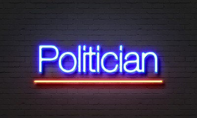 Obraz premium Politician neon sign on brick wall background.