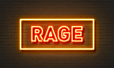 Rage neon sign on brick wall background.